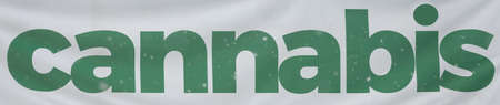 White Banner with the Word Cannabis in Green Letteringの写真素材