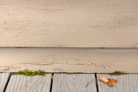 Wood Siding on House shows peeling and cracked painting and early signs of decay and rotの写真素材