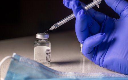 Medication Vial with Medical Syringe depicting The Corona-19 Vaccination.の写真素材