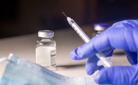 Medication Vial with Medical Syringe depicting The Corona-19 Vaccination.の写真素材