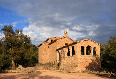 The chapel of Mare de Deu de Farners in the warm afternoon light (Catalonia, Spain)の写真素材