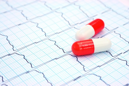 Two capsules on electrocardiogram (Shallow depth of field)の写真素材