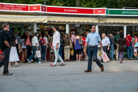 People walking through the book fair in Madrid in June 2011のeditorial素材