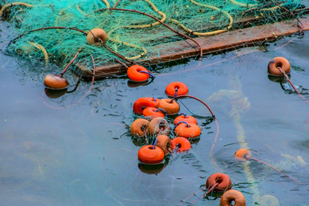 Fishing nets floating in the seaの写真素材