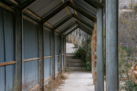Iron footbridge on the rockの写真素材