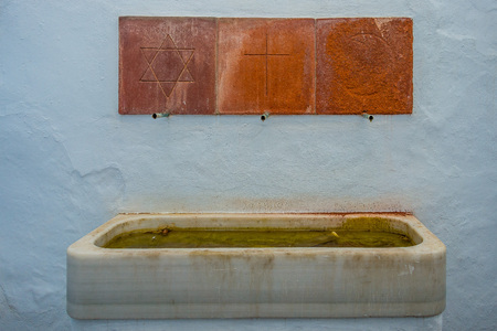 Old pile with tiles on white background located in Frigiliana, Malagaの写真素材