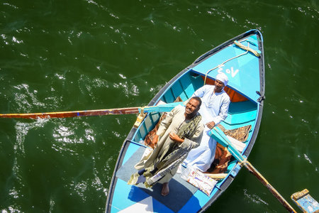 Vendors of tablecloths offering tourists a cruise on the Nile. Egypt. April 2019