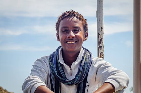 Portrait of beautiful young African man smiling at the camera in Egypt in April 2019.のeditorial素材