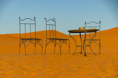Chairs and table in the Sahara desert in Merzouga. Moroccoの写真素材