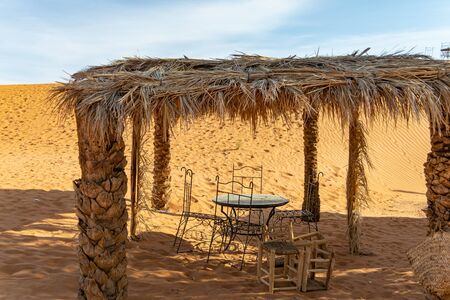 Chairs and table in the Sahara desert in Merzouga. Moroccoの写真素材