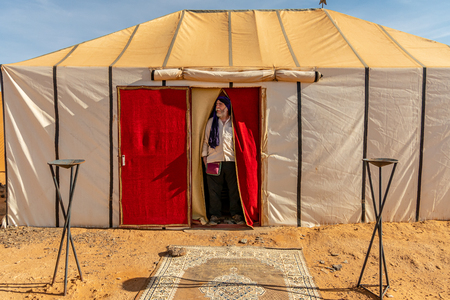 Portrait of white man with a beard and blue turban at the entrance of a haimaのeditorial素材
