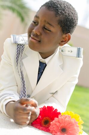 Portrait of black child dressed in first communionの写真素材