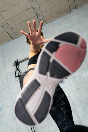 Sole of young woman's sneaker