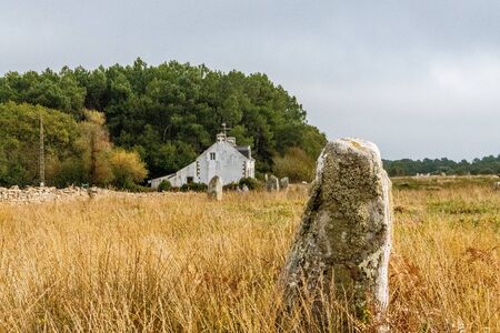 Menhir and typical House in the Carnac Alignments, Brittany Region. Franceの写真素材