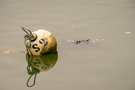 Buoy floating in the calm sea.