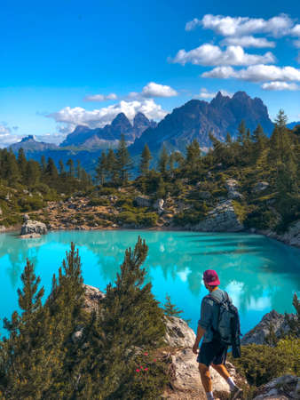 Man in the Dolomites. In front of Lake Sorapis. Turquoise lake. Mountainsの写真素材