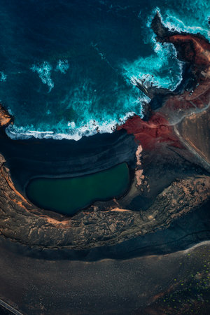 Woman standing on Famara cliff, Lanzaroteの写真素材