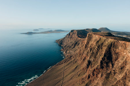 Woman standing on Famara cliff, Lanzaroteの写真素材