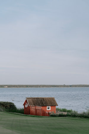 A small swedish house on Gotland in Sweden right by the sea.の写真素材