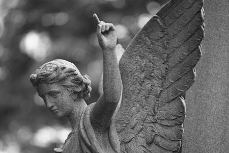 Stone angel, pointing to heavenの写真素材