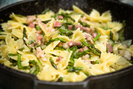 Farfalle with bacon and asparagus Italian Pastaの写真素材