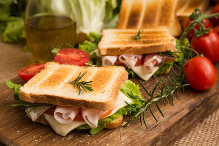 Toasted sandwich with ham, cheese and lettuce