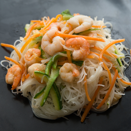 Rice noodles with shrimps, courgettes and carrotsの写真素材