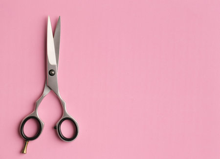 Metal scissors with place for text. Professional salon haircut, hair care. A quality tool....