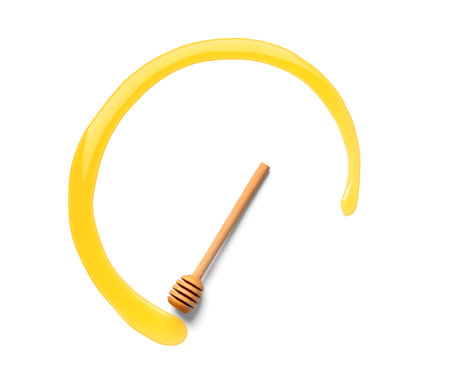 honey dipper with honey in circle shape. Honey was poured on white background with copy space. design concept. Space for text.の写真素材