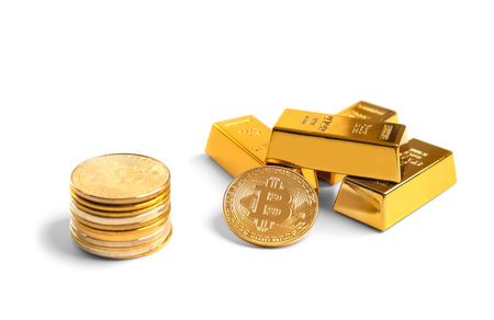 Heap of bitcoin coins and gold bars isolated on white background. Cryptocurrency close-up on isolation. Ingots of gold. Currency growth conceptの写真素材