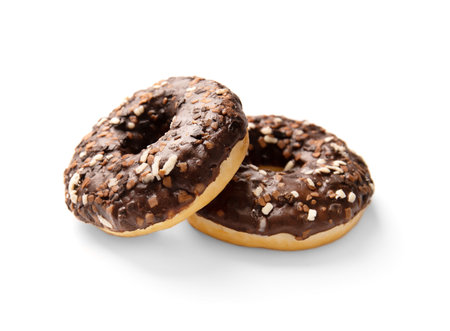Donuts in chocolate isolated. Sweet breakfast. Dessert. junk food. Two chocolate donuts on a white background.の写真素材