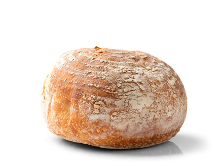 Craft round white bread made from wheat flour on a white background close-up. Fresh homemade...