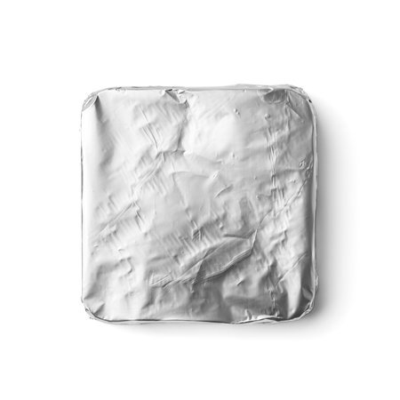 A bar of chocolate is wrapped in silver foil on a white background top view. Chocolate in foil packaging on isolation.の写真素材