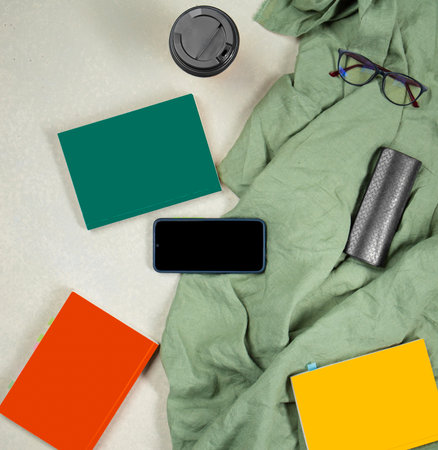 Creative flat lay photo of workplace of businessman, lawyer with smartphone, books, glasses, notebook, cup of coffee top viewの写真素材