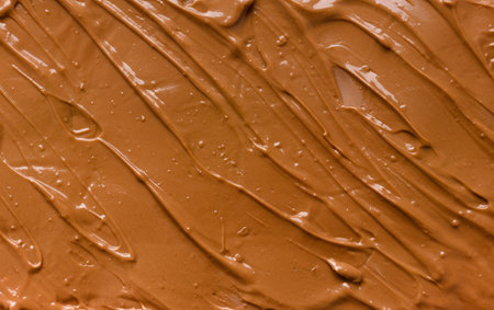 chocolate background. melted chocolate. Liquid milk chocolate. handmade chocolate.の写真素材