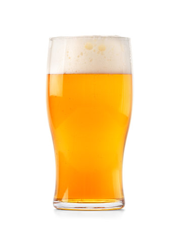 A glass of light beer with beautiful foam isolated on a white background, beer in a glass mug.の写真素材