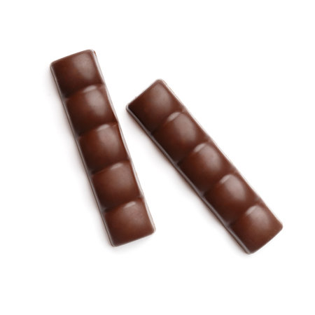 Chocolate bars on a white background, close-up. Porous, airy chocolate, top viewの写真素材