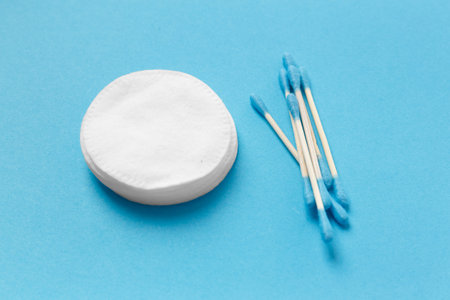 Composition from cotton swabs buds and cotton pads on a white background. The concept of personal hygiene, medicine, makeup, cleansing, skin care.の写真素材