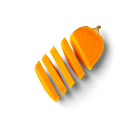 Ripe sweet butternut squash cut into slices, isolated on a white background. Cut orange pumpkin in the shape of a bottle.の写真素材