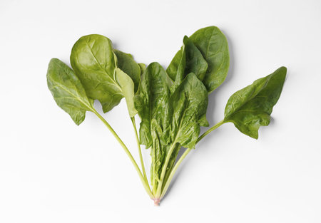 Bunch of fresh green organic spinach isolated on white background, top view. Useful products, a...