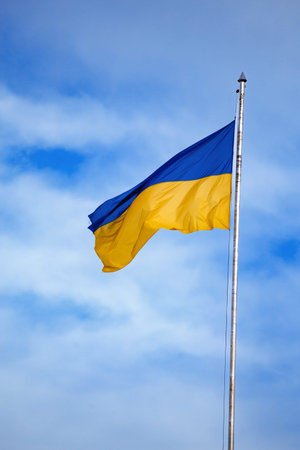 Flag of ukraine against the blue sky close-up. National pride and symbol of the country Ukraine. War in Ukraine. Yellow-blue flag.の写真素材