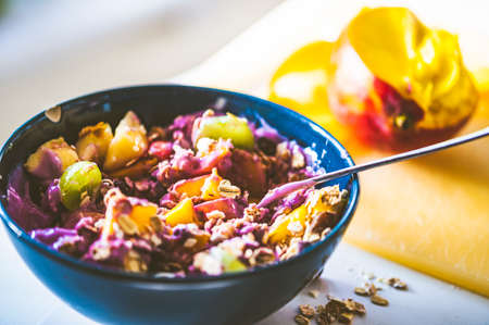 A bowl with muesli and fruitsの写真素材