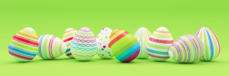 3d render of ten colorful, painted Easter eggs on green backgroundの写真素材