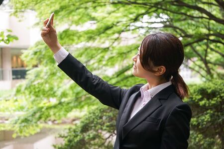 Young businesswoman taking a selfie with smileの写真素材