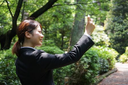 Young businesswoman taking a selfie with smileの写真素材