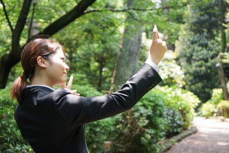 Young businesswoman taking a selfie with smileの写真素材
