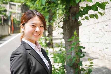 Young business woman working with a smileの写真素材
