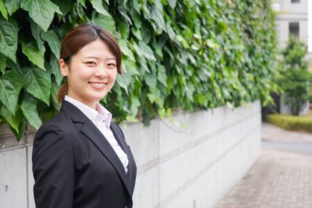 Young business woman working with a smileの写真素材