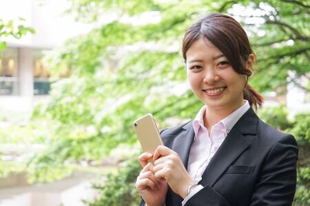Young businesswoman using smartphoneの写真素材