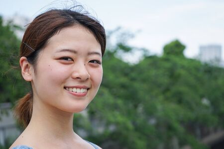 Young woman running in the cityの写真素材